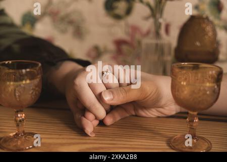Couple holding hands with ring Stock Photo