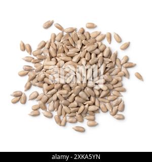 Heap of shelled sunflower seeds close up on isolated white background Stock Photo
