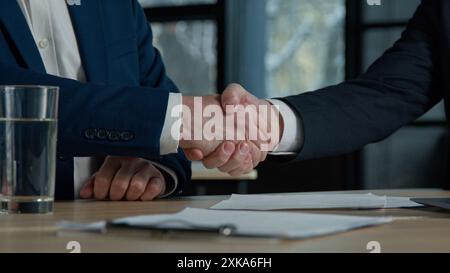 Close-up two unrecognizable businessmen men negotiating at business meeting in office advisor lawyer financial expert consulting customer explaining Stock Photo