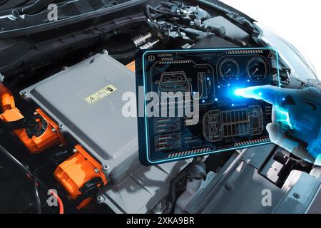 EV electric vehicle technology industry concept , futuristic virtual graphic touch user interface on screen with electric motor control unit of electr Stock Photo