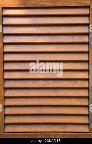 Window with wooden shutters, wooden blinds. Wood texture, wood background Stock Photo