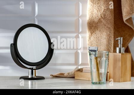 Image for montage objects display with hygiene products untensils on a cabinet on a bright white bathroom tiled wall background. Stock Photo