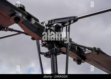 A joint of helicopter blades Details of the rotor and part of the body of modern military helicopters closeup Stock Photo