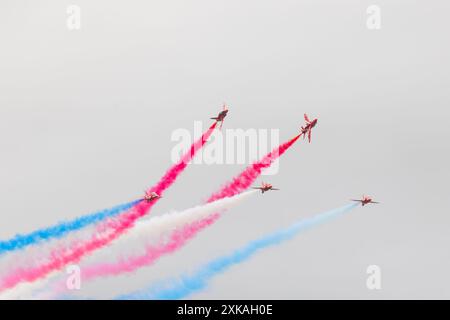 Fairford, UK. 21 JUL, 2024. Red arrows perform as thousands decended on the Royal International Air Tattoo (RIAT), one of the worlds largest airshows with over 200 planes on the USAF RAF Fairford site with multiple flying displays. Credit Milo Chandler/Alamy Live News Stock Photo