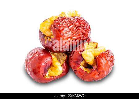 Delicious dried chinese jujube stuffed with crunchy walnut isolated on white background with clipping path. Stock Photo