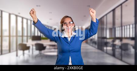 business concepts. Very happy and excited woman making a winning gesture with her arms raised. executive celebrating corporate success Stock Photo