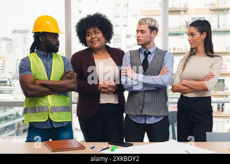 Group of Multi Ethnic Business people in office talking to the construction site engineer who is a uniformed African man with helmet and reflective ve Stock Photo