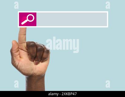 Man using search bar on virtual screen against light turquoise background, closeup Stock Photo