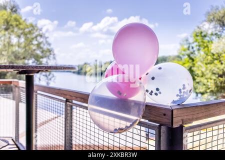 Decorative balloons on a reiling at a wedding Stock Photo