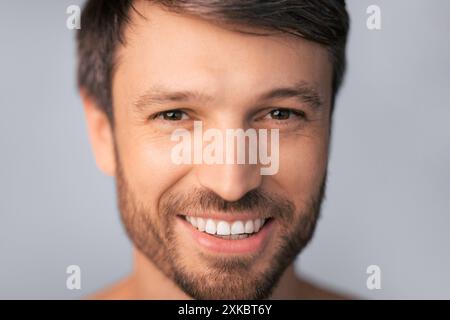 Man Smiling With Brown Hair and Beard Stock Photo