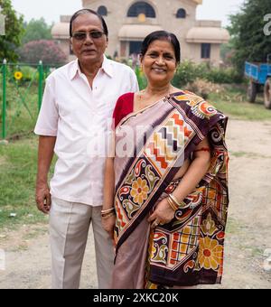 Portrait of an aged Indian couple smiling on white background Stock ...