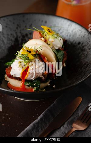 Vegetarian Bao buns with poached eggs and herbs. Restaurant brunch. Chinese, asian, authentic food concept. Stock Photo