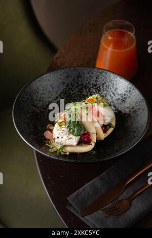Vegetarian Bao buns with poached eggs and herbs. Restaurant brunch. Chinese, asian, authentic food concept. Stock Photo