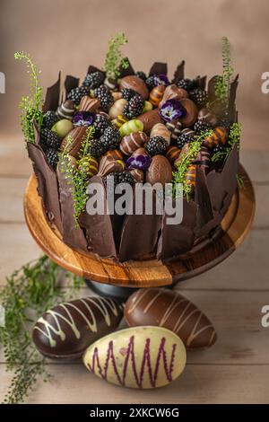 Easter chocolate cake. Beautifully decorated on the table with easter eggs. Stock Photo