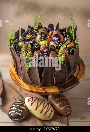 Easter chocolate cake. Beautifully decorated on the table with easter eggs. Stock Photo