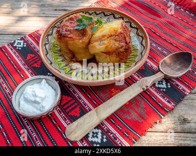 bell peppers stuffed with minced meat and served with sour cream, balkan, romanian cuisine Stock Photo