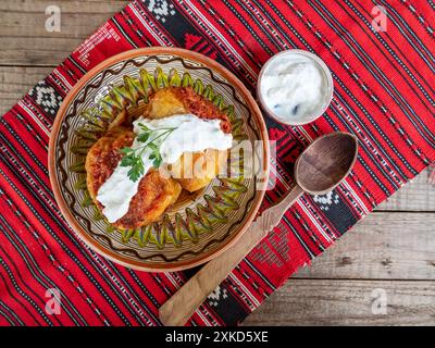 bell peppers stuffed with minced meat and served with sour cream, balkan, romanian cuisine Stock Photo