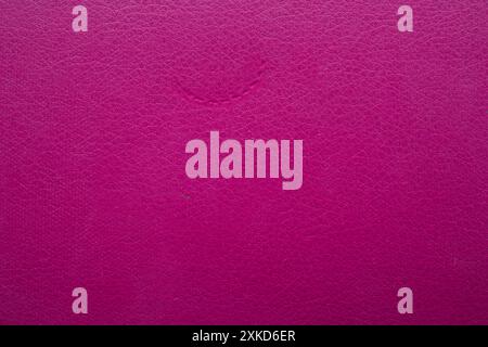 pink faux leather background is used to wrap book covers or to repair everyday leather sofa seats and appliances. background and pattern on the pink f Stock Photo