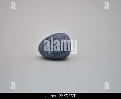 Smooth Tumbled Blue Lapis Lazuli Stone on White Background Stock Photo