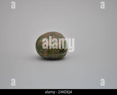 Smooth Tumbled Unakite Stone on White Background Stock Photo