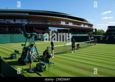 General view of No.1 Court and Court 15 being set up by Court Attendants during The Championships 2024. Wimbledon Stock Photo