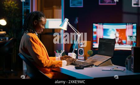 Database engineer student writing code for improving network or debugging server, using html script on terminal window. Girl learning programming language and infographics. Camera A. Stock Photo
