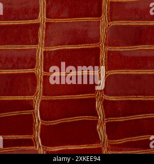 Seamless 4k photo texture photo of red colored alligator skin leather material. Stock Photo