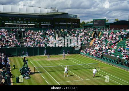 General view of action on No.2 Court with Centre Court at The Championships 2024. Wimbledon Stock Photo