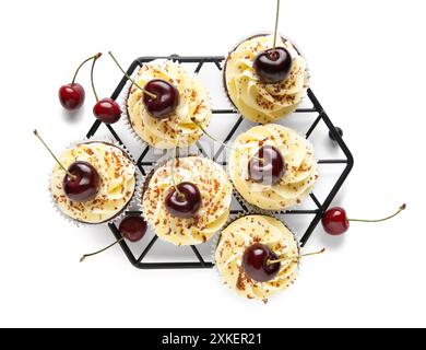Stand with sweet cherry cupcakes and berries on grey background Stock Photo