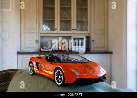 A toy Ferrari car in an abandoned house. This house has since been demolished. Stock Photo