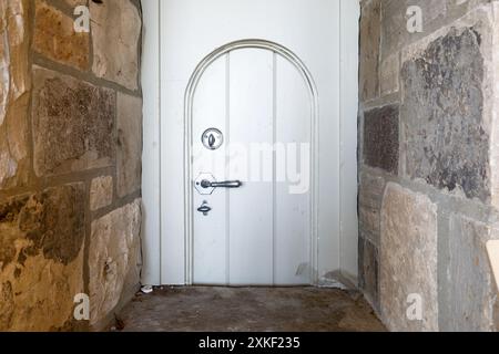 A very small wooden door. This house has since been demolished. Stock Photo