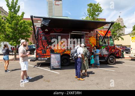 The red and orange Mo's Tacos food truck parked in downtown Fort Wayne, Indiana, USA. Stock Photo