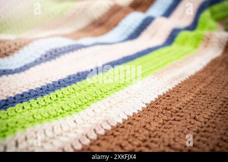 Oblique  multi colored crochet lines pattern, perspective soft focus close up Stock Photo
