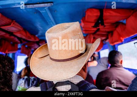 Man on a bus wearing a traditional Guatemalan hat, Lake Atitlán, Sololá, Republic of Guatemala, Central America. Stock Photo