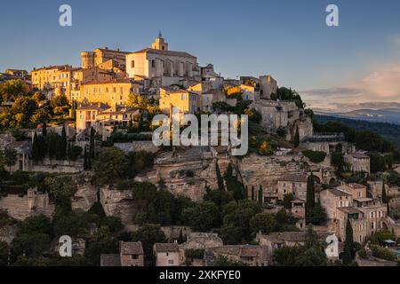 An evening during sunset at Gordes, a municipality and village in the Vaucluse department of France. Gordes is a charming town in the Provence, locate Stock Photo