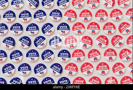 Pattern of Democrat and Republican vote buttons arranged on a surface, showcasing the symbols and colors of both parties in 3D rendering Stock Photo