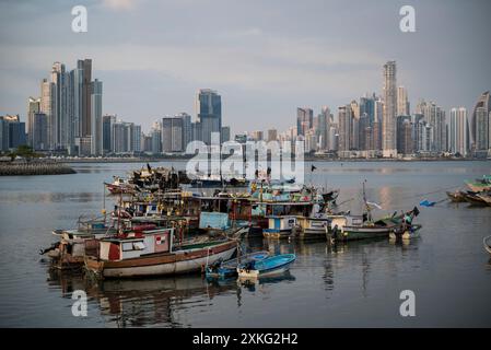 Fishing boats outside Mercado De Marisco Cinta Costera, Panama Bay and the modern cityscape, Panama City, Panama Stock Photo