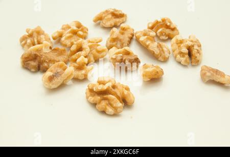 walnuts with and without shell, on white background. Stock Photo