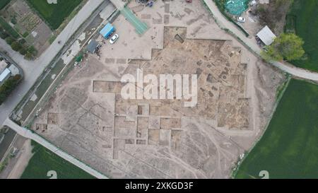 (240723) -- CHENGDU, July 23, 2024 (Xinhua) -- An aerial drone photo taken on March 23, 2024 shows a view of the Sanxingdui Ruins site in Guanghan City, southwest China's Sichuan Province. Archaeological authorities have recently unveiled groundbreaking discoveries, including a jade and stone artifact 'workshop' dating back over 3,400 years, at the legendary Sanxingdui Ruins site. The new finds offer vital insights into the origins of various precious cultural relics and highlight the remarkable achievements of ancient Chinese civilization. (Sichuan cultural relics and archaeology research ins Stock Photo