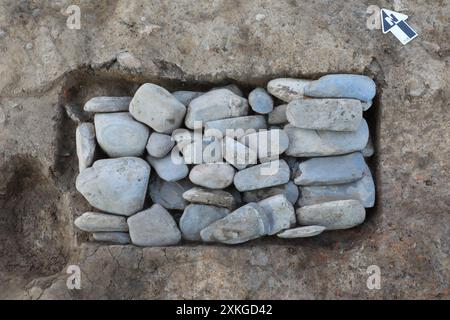 (240723) -- CHENGDU, July 23, 2024 (Xinhua) -- This file photo taken on March 13, 2023 shows the first layer of a stone axe pit discovered at the Sanxingdui Ruins site in Guanghan City, southwest China's Sichuan Province. Archaeological authorities have recently unveiled groundbreaking discoveries, including a jade and stone artifact 'workshop' dating back over 3,400 years, at the legendary Sanxingdui Ruins site. The new finds offer vital insights into the origins of various precious cultural relics and highlight the remarkable achievements of ancient Chinese civilization. (Sichuan cultural re Stock Photo