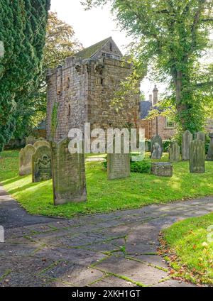 Vicar's Pele Tower with gravestones, Corbridge, Northumberland, UK Stock Photo