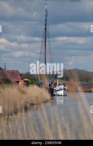 boats moored on river alde at snape suffolk england Stock Photo