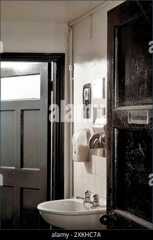 gents toilet in old run down redundant pub bungay suffolk england Stock Photo