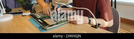 Colleagues Working With Broken Computer In Team Stock Photo