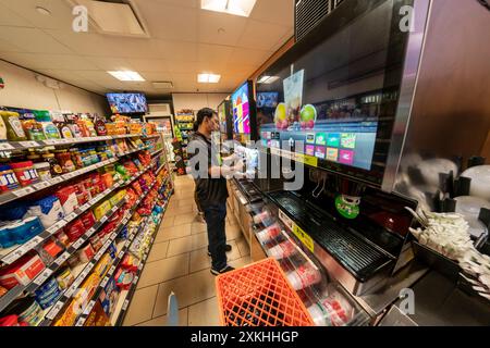 Free Slurpeesare prepared in a 7-Eleven store in New York on Thursday, July 11, 2024 (7-11, get it?),the self-proclaimed holiday, Free Slurpee Day! The popular icy, slushy, syrupy drinks are available in combinations, and the stores have stocked up with extra barrels of syrup to meet the expected demand. According to the meticulous figures kept by 7-Eleven they sell an average of 14 million Slurpees a month and over 150 million Slurpees a year.  (© Richard B. Levine) Stock Photo