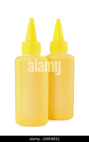 Bottles of yellow printer ink isolated on white Stock Photo - Alamy