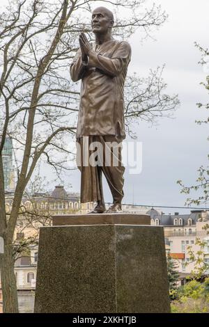 Indian guru Sri Chinmoy. Prayer for peace. Ganapati Kumar Ghose. Sculpture street statue. Ukraine, Kyiv - April 15, 2024. Stock Photo