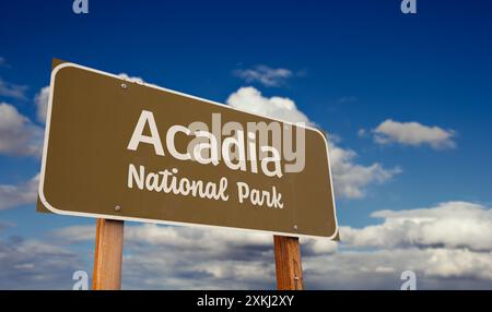 Acadia National Park (Maine) Road Sign Against Blue Sky and Clouds. Stock Photo