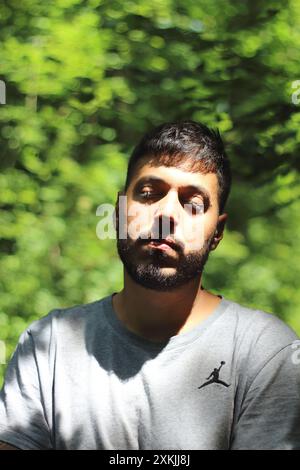 A vibrant image featuring a young tattooed man in sporting clothes, enjoying a sunny day in the city of Zurich. Perfect for themes related to urban li Stock Photo