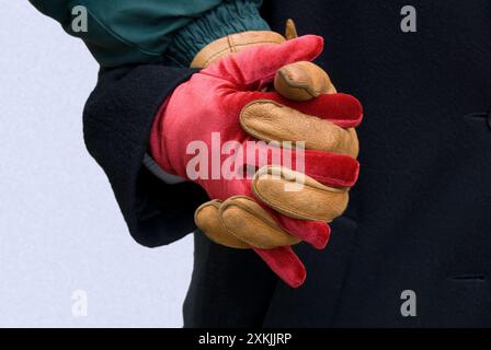 man and woman clasp gloved hands -  Vienna, Austria Stock Photo